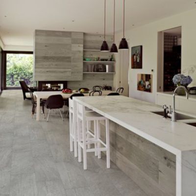 grey floor tiles in a large open concept kitchen and dining room for Pullman homes